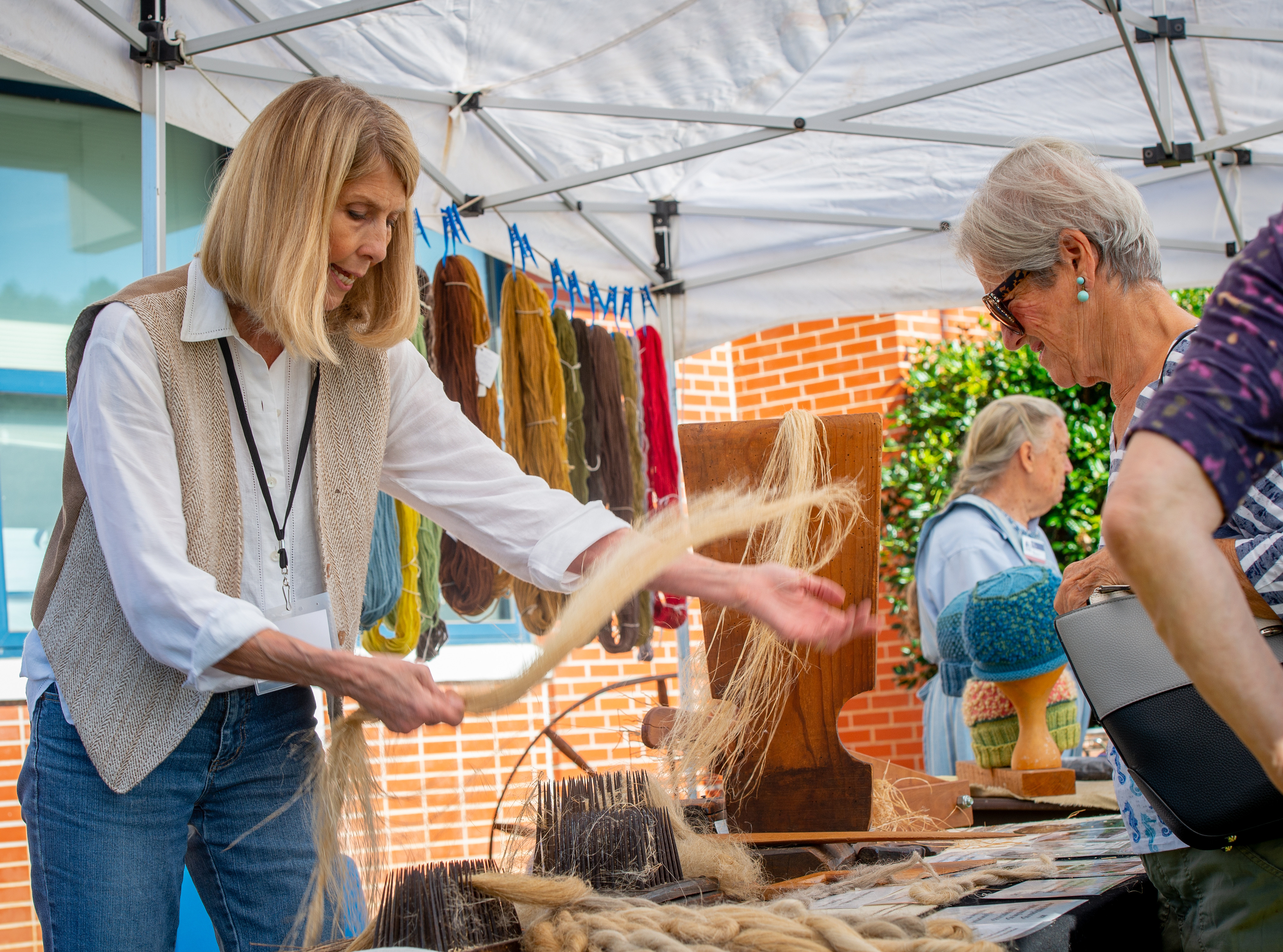 Cassie Dickson demonstrates spinning and dyeing at a past event