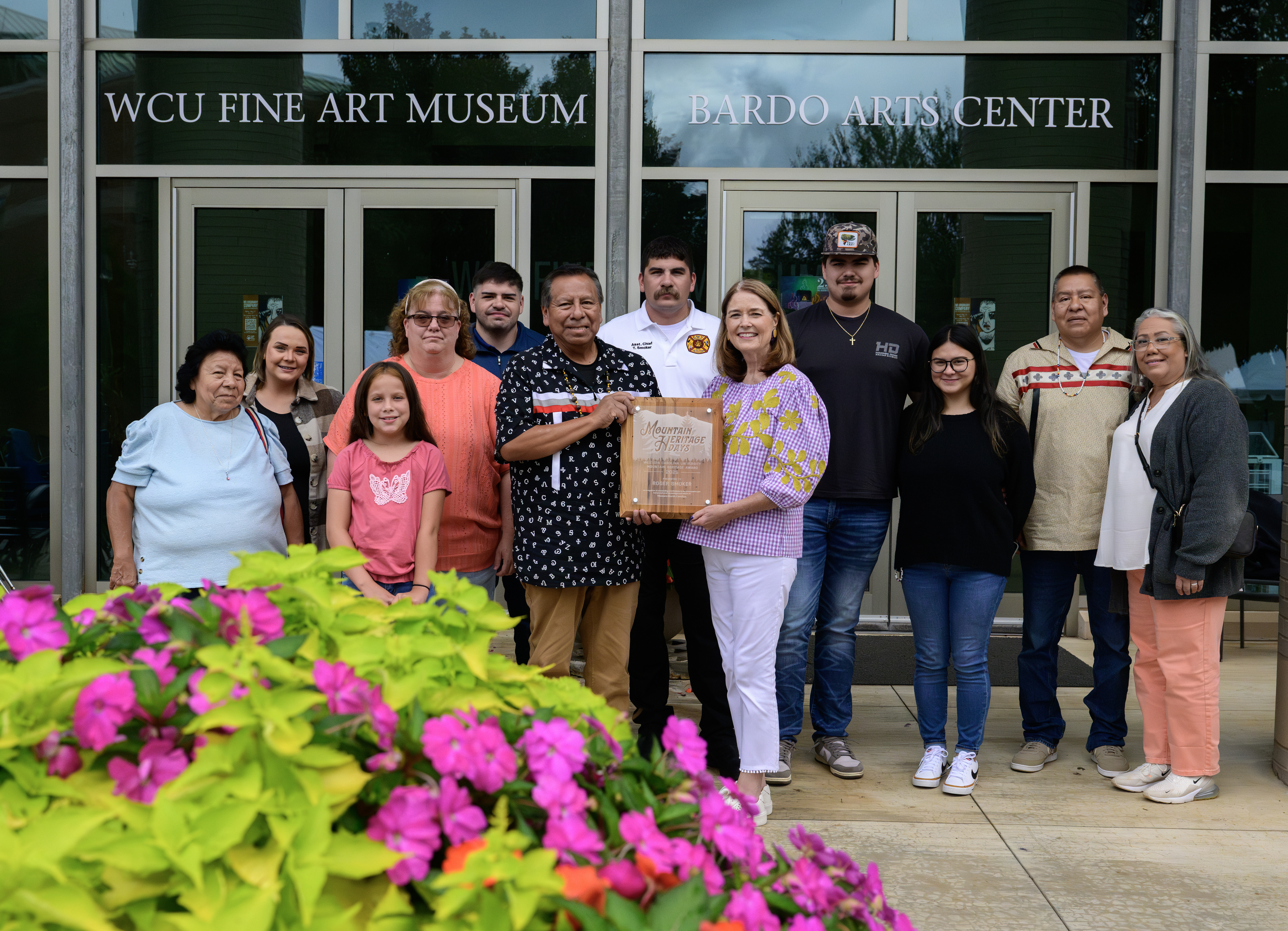 2025 individual award winner Robert Smoker stands with WCU Chancellor Kelli R. Brown and family outside of the Bardo Arts Center at �����Ƶapp 