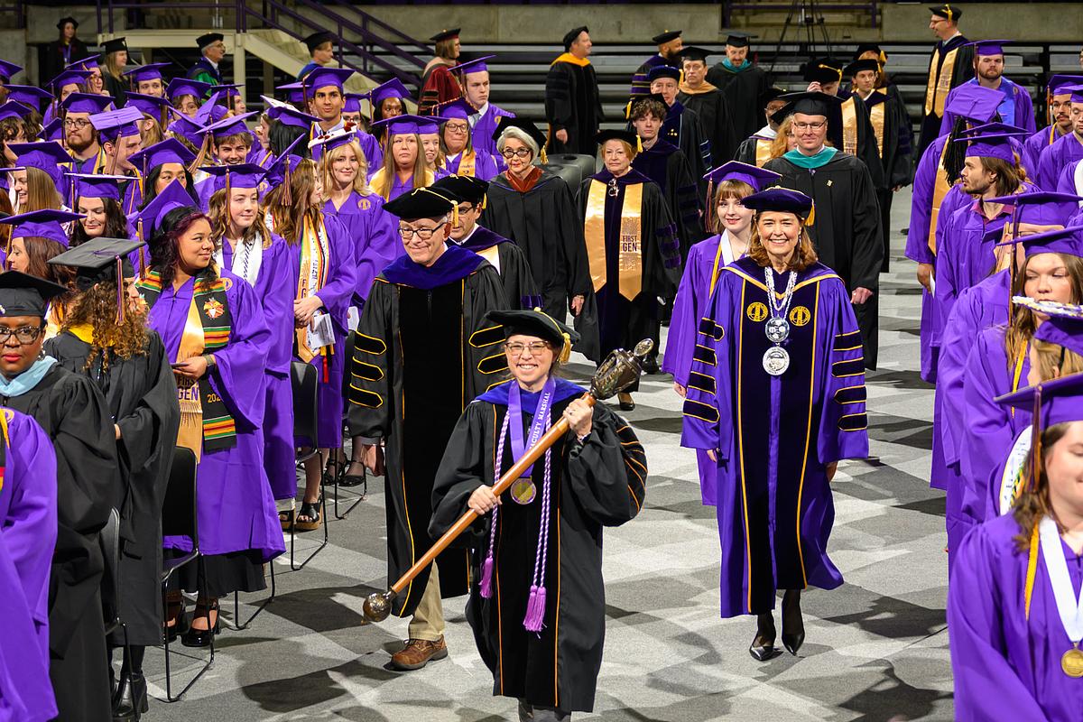 Graduation begins with Chancellor and others walking down the center aisle