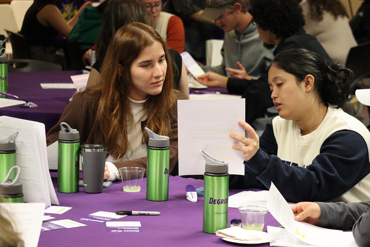 Students sitting at a table working together