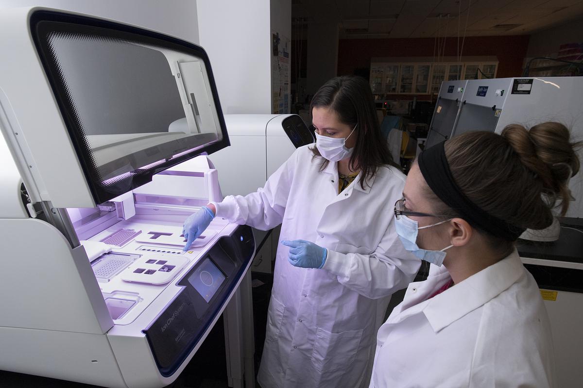 Students working with materials and equipment in a lab