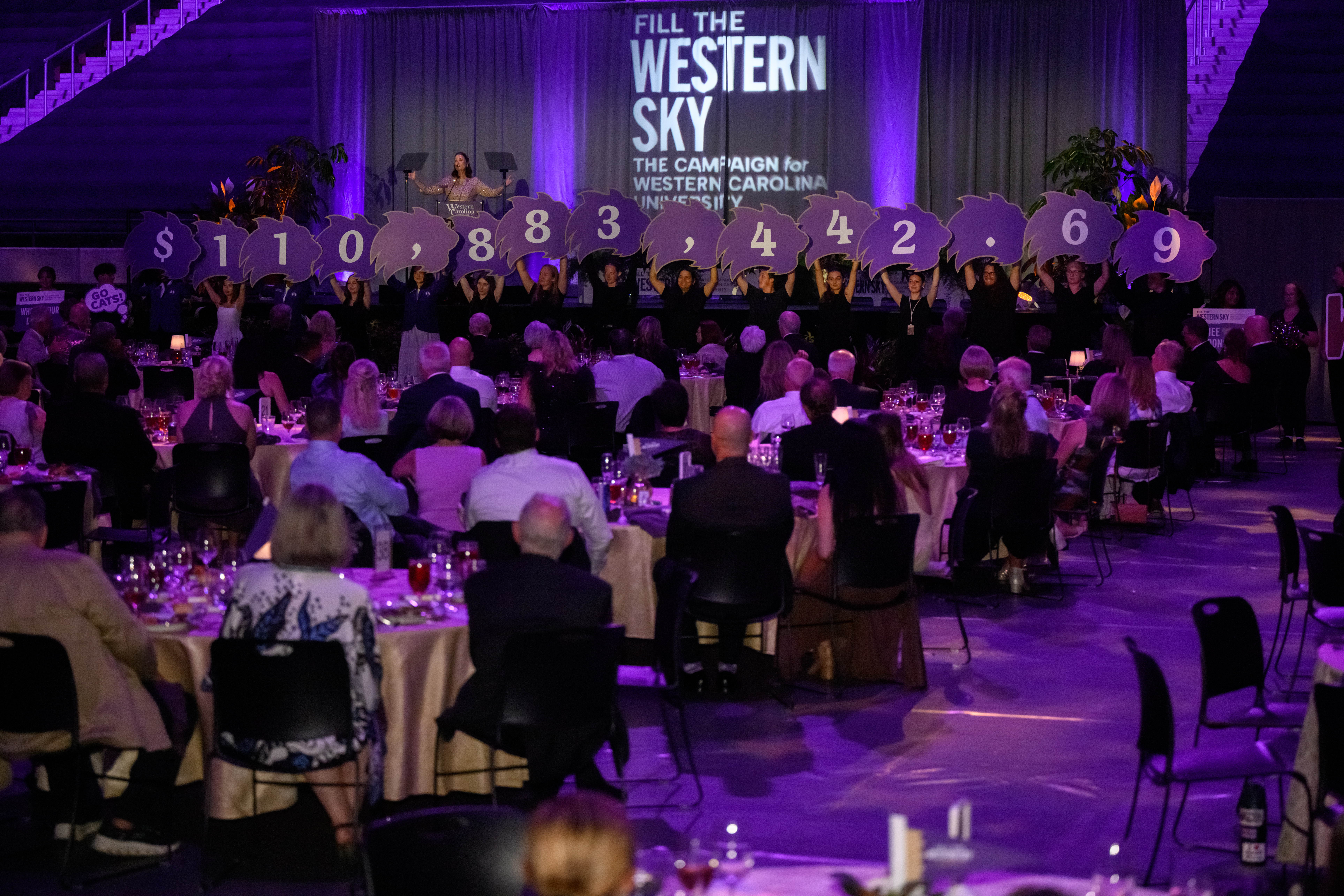 Gala attendees celebrate the final amount raised