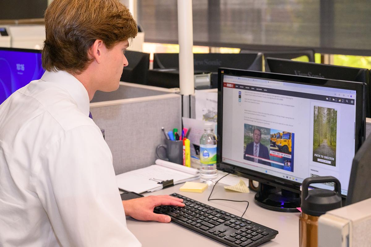 student at computer (decorative)