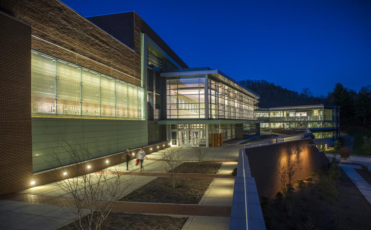 Night-time photo of the front of the Health and Human Sciences building