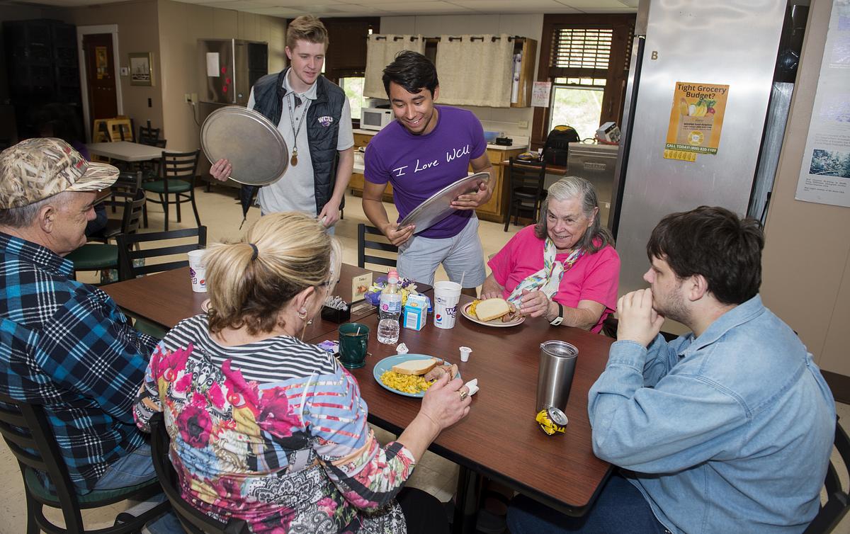 Student and community members at the local Community Table
