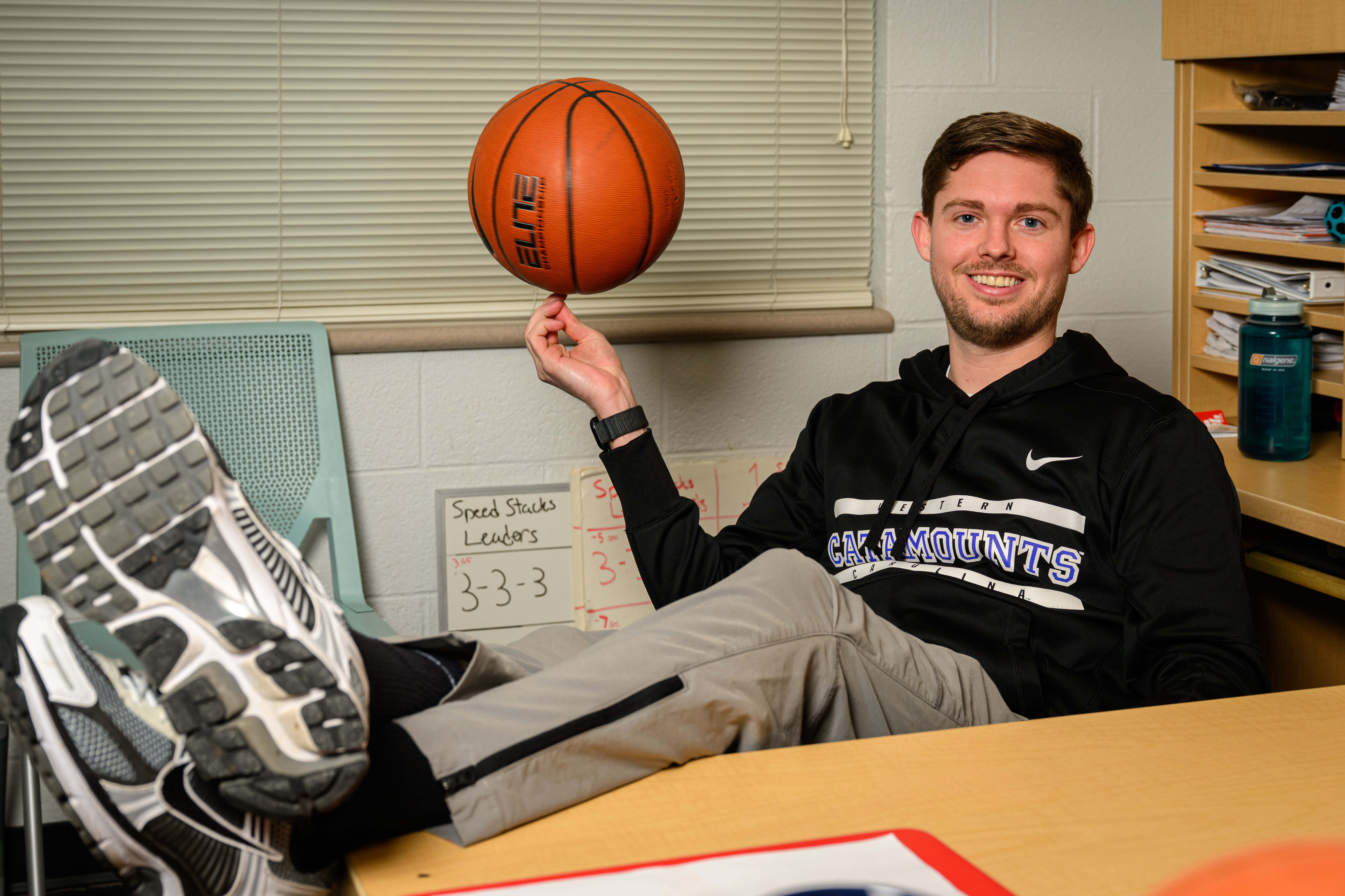 Canaan Frisby spins a basketball on his finger.