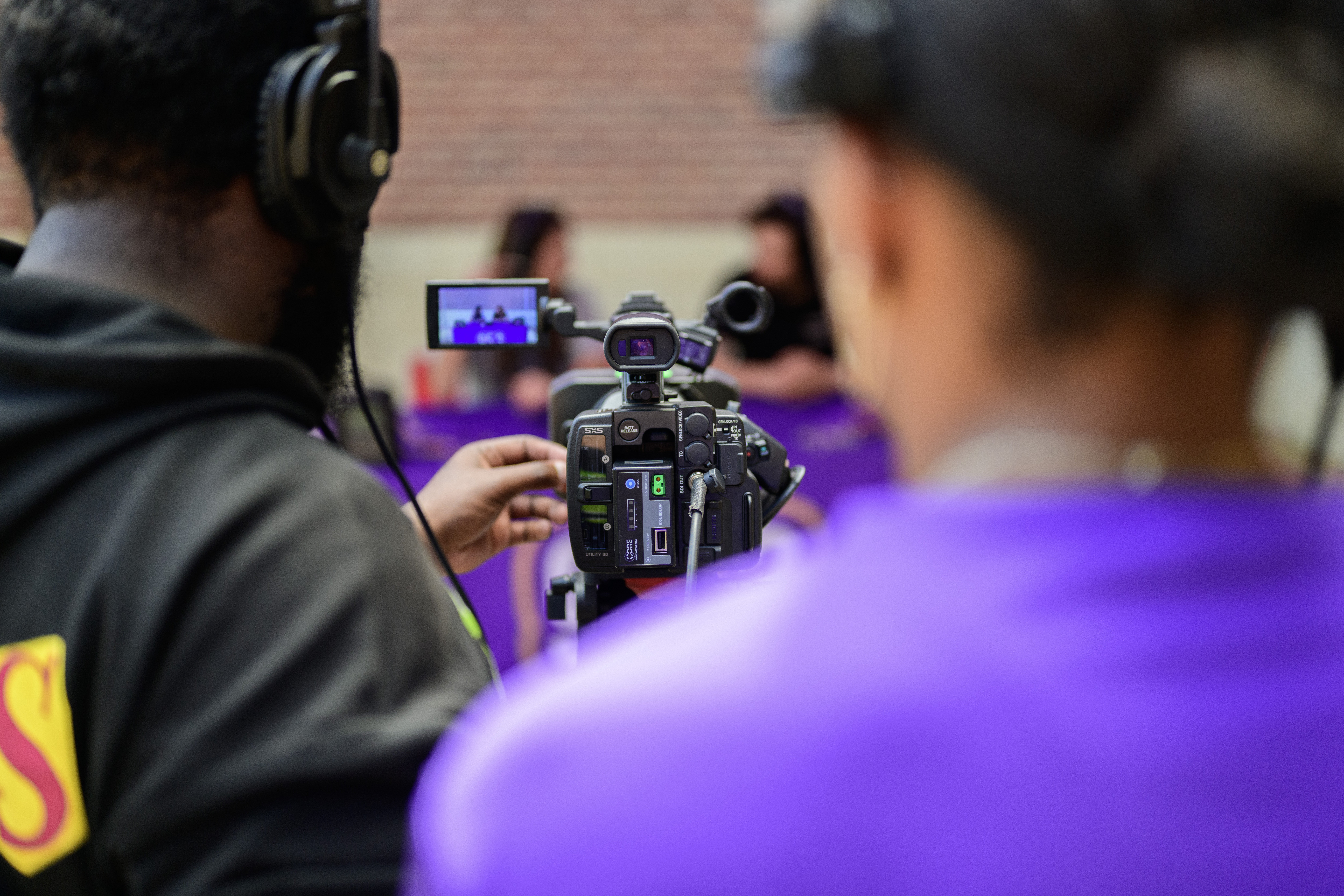 Two students working with a camera