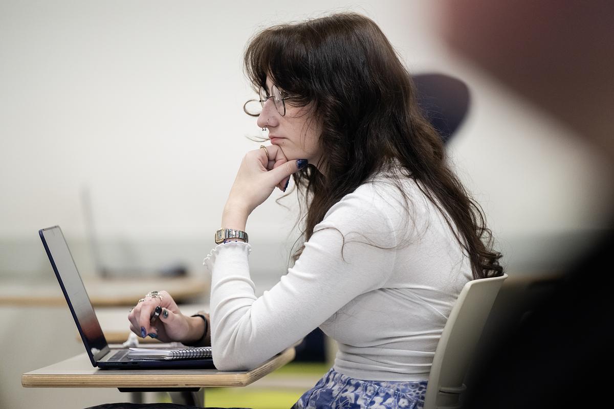 student at laptop (decorative)