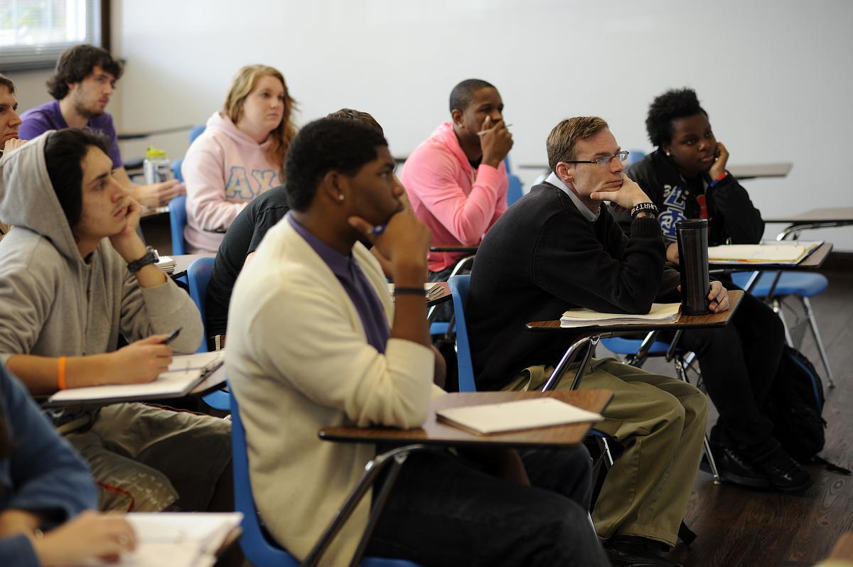 Students listen to a lecture during a sociology class