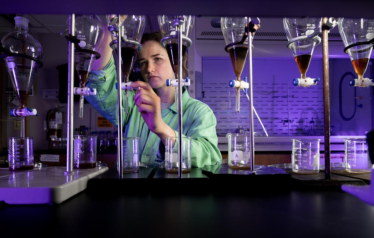 Chemistry student in the lab working with equipment