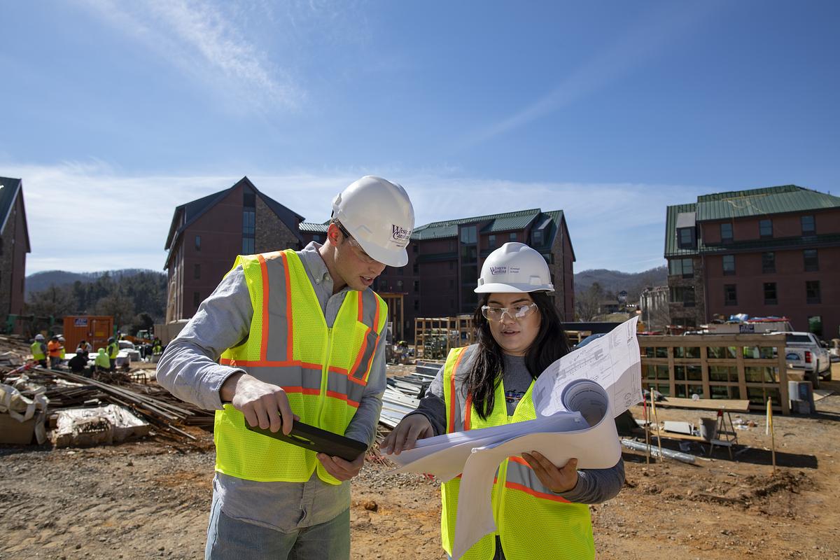 Construction management students review plans