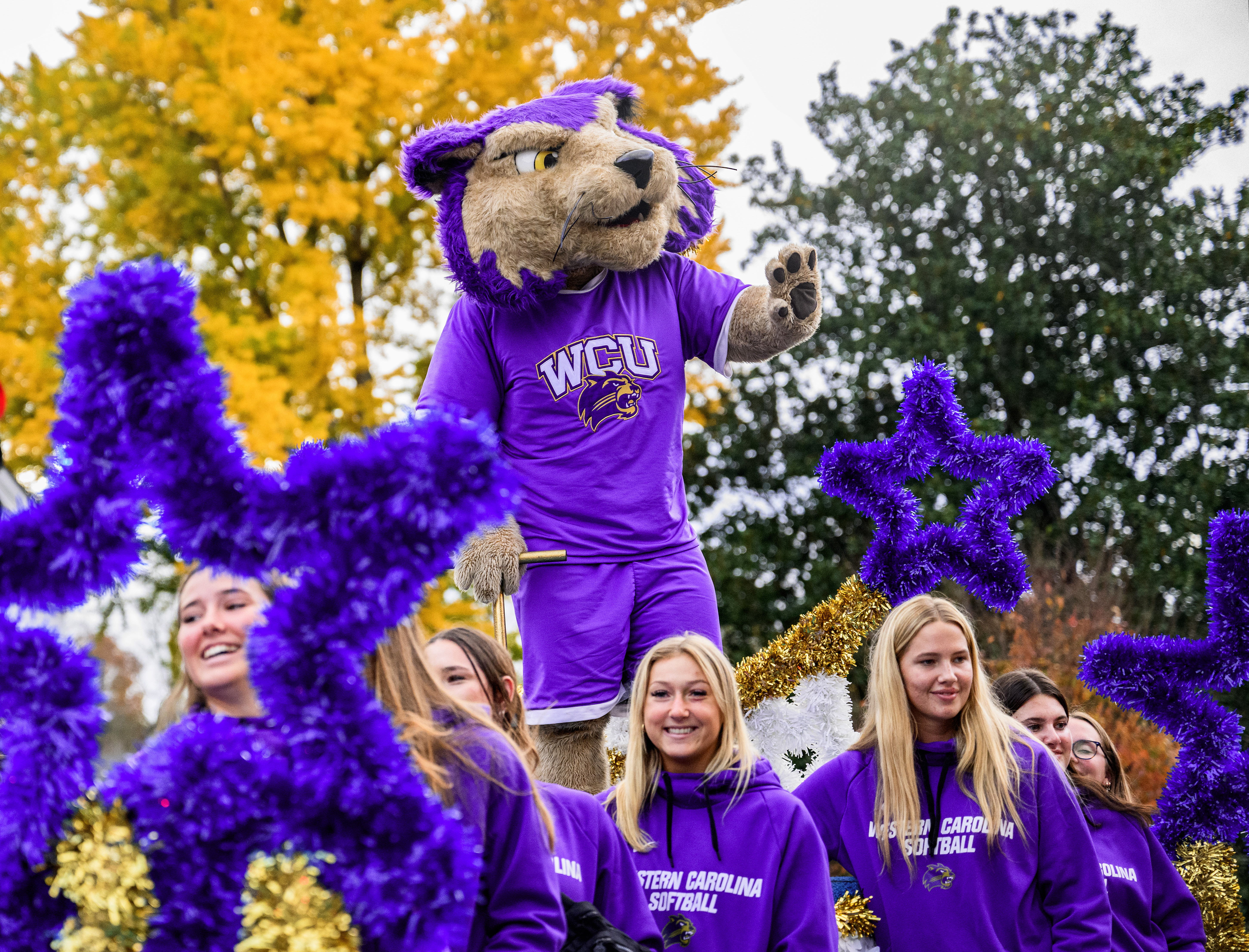 Paws rides on a float during the 2024 homecoming parade