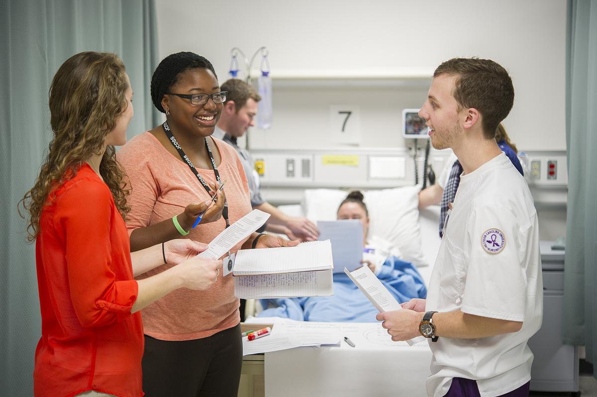Nutrition dietetic practitioners talking together in a hospital room