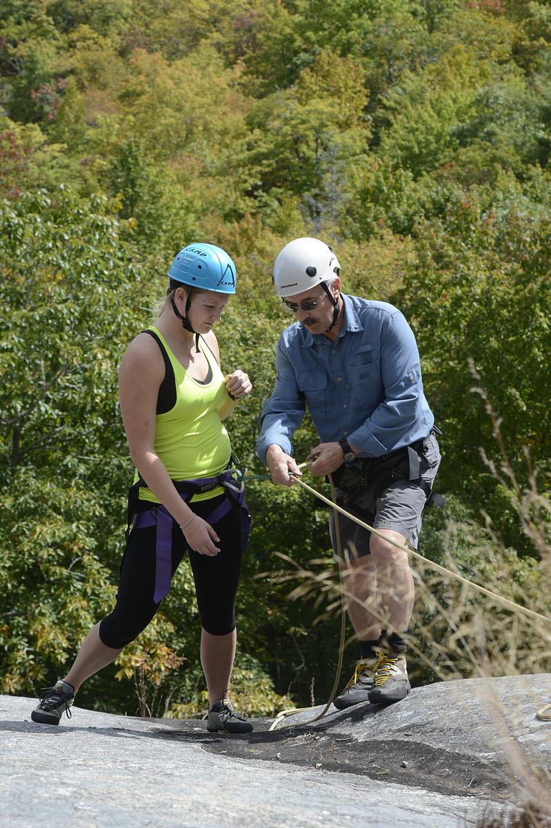 Students paddle boarding on a beautiful summer day