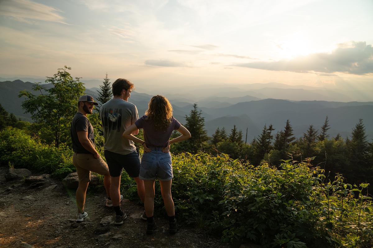 Students standing at an overlook talking and enjoying the mountain views together