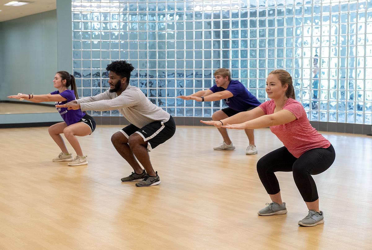 Students doing body weight squats