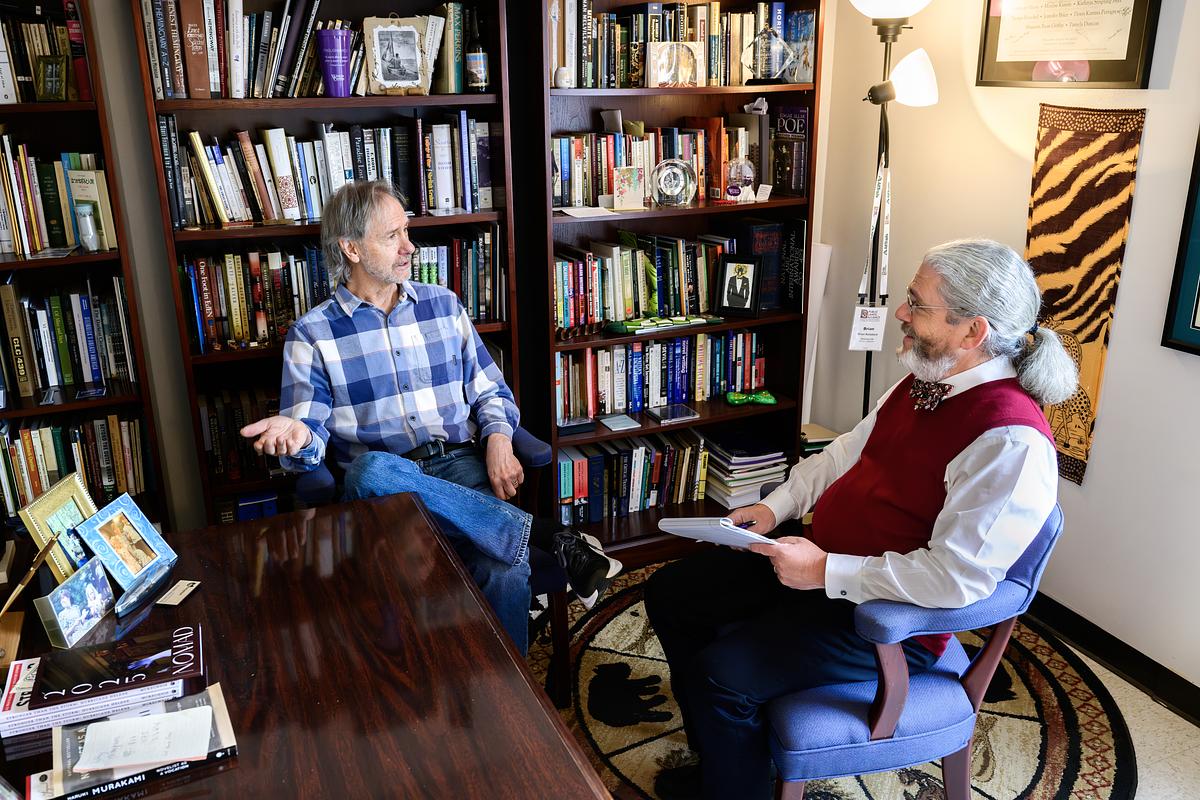 Ron Rash and Brian Railsback in discussion in an office