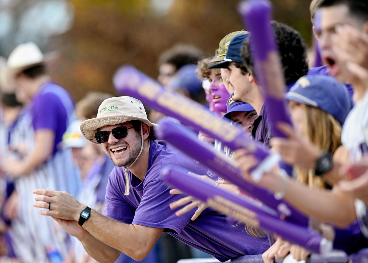 Students cheering in a full stadium at the WCU football homecoming game