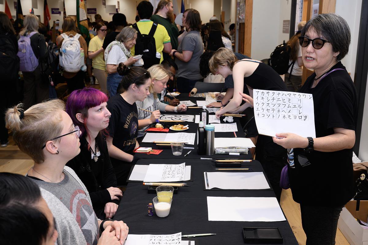 Japan program table where students and community members practice calligraphy