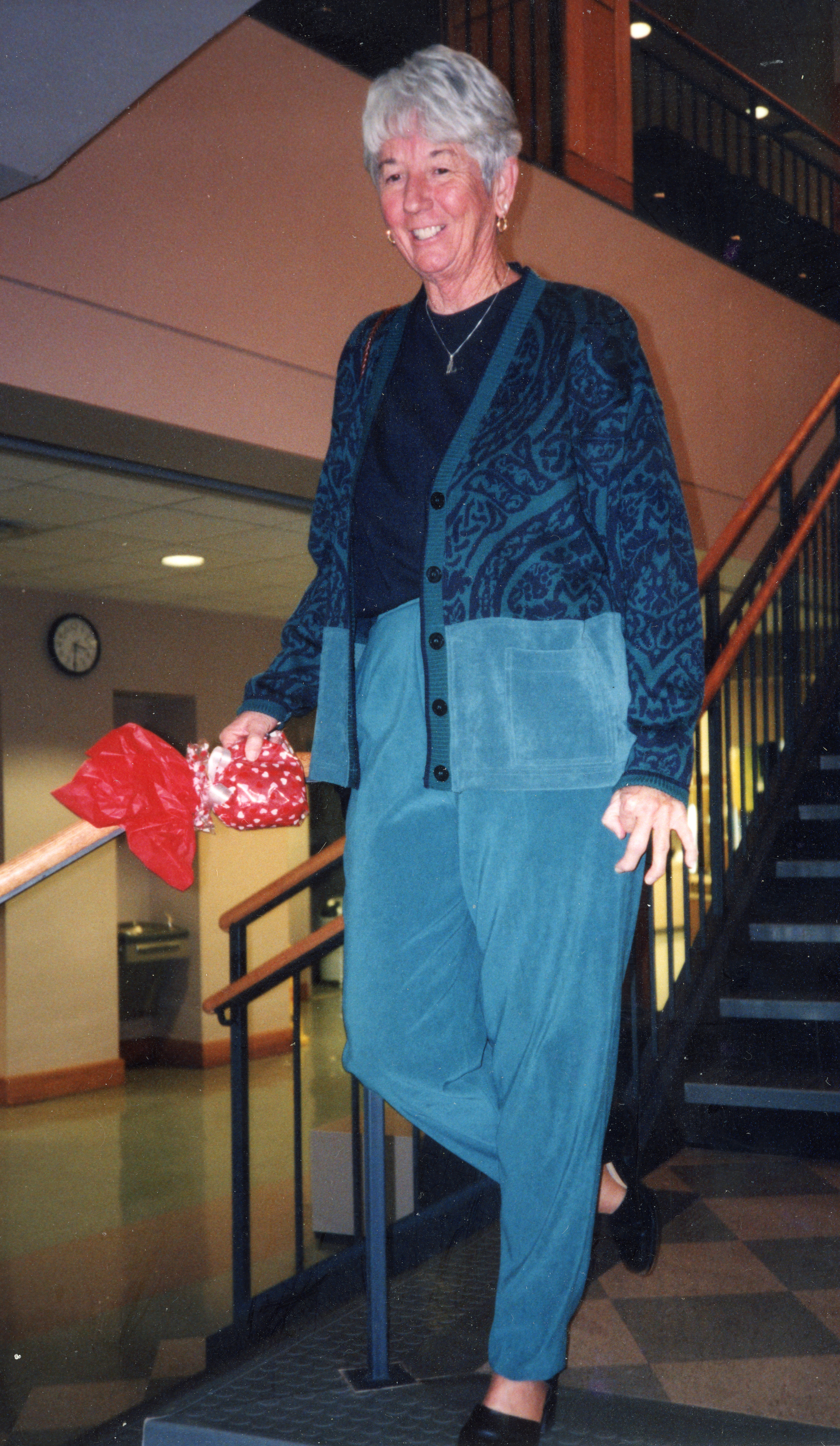 Betty Peele walks down a staircase
