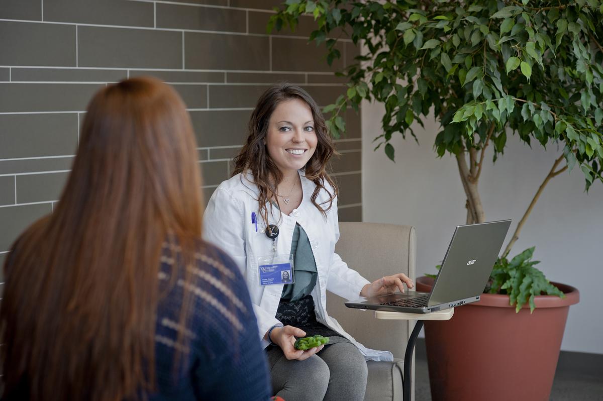 Nutrition and Dietetics practitioner talking with a patient
