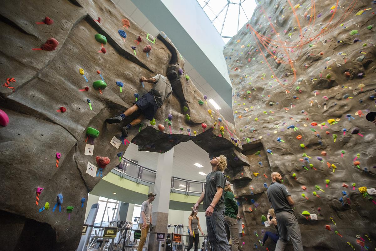 Student climbing on a climbing wall