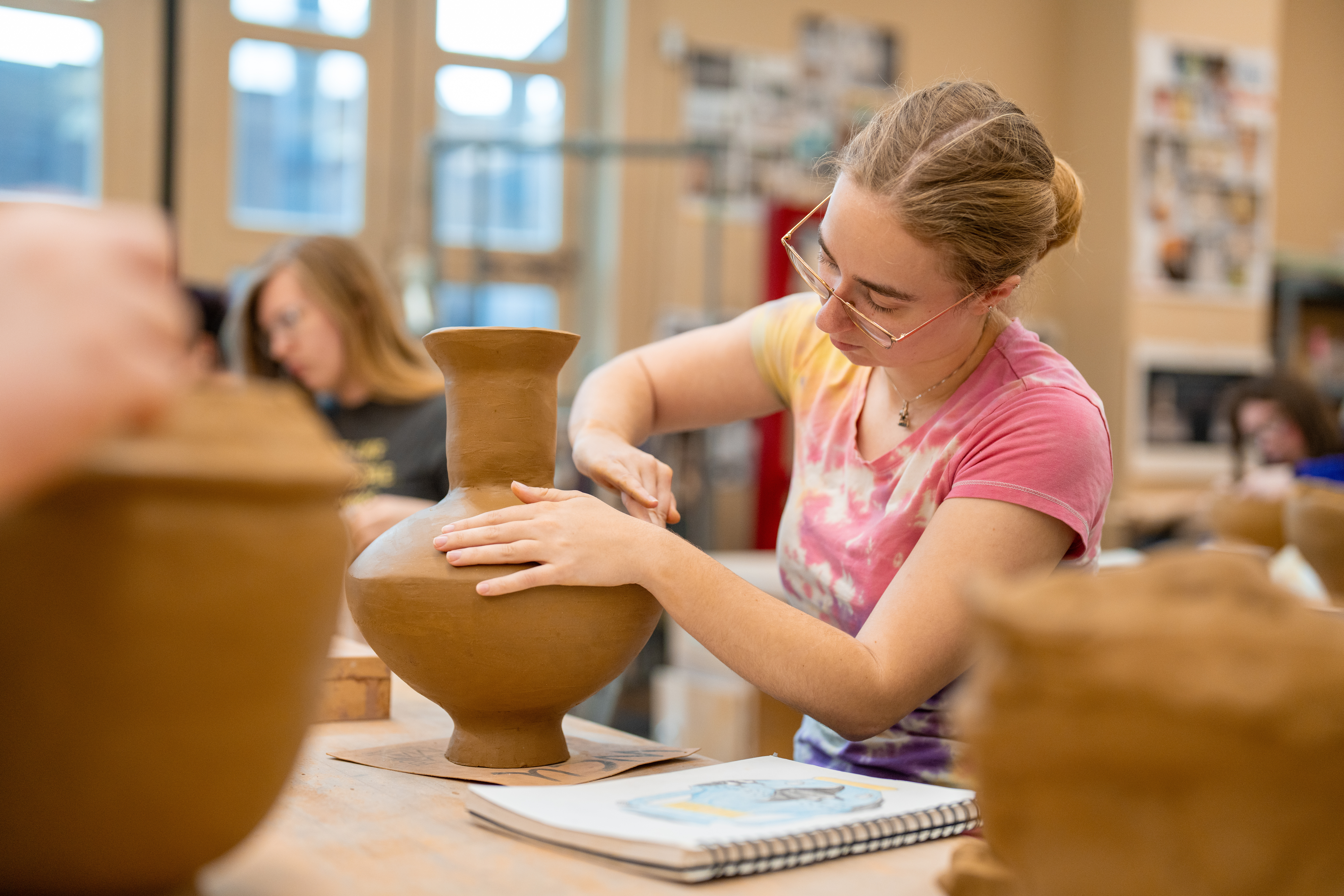 Student in Ceramics class