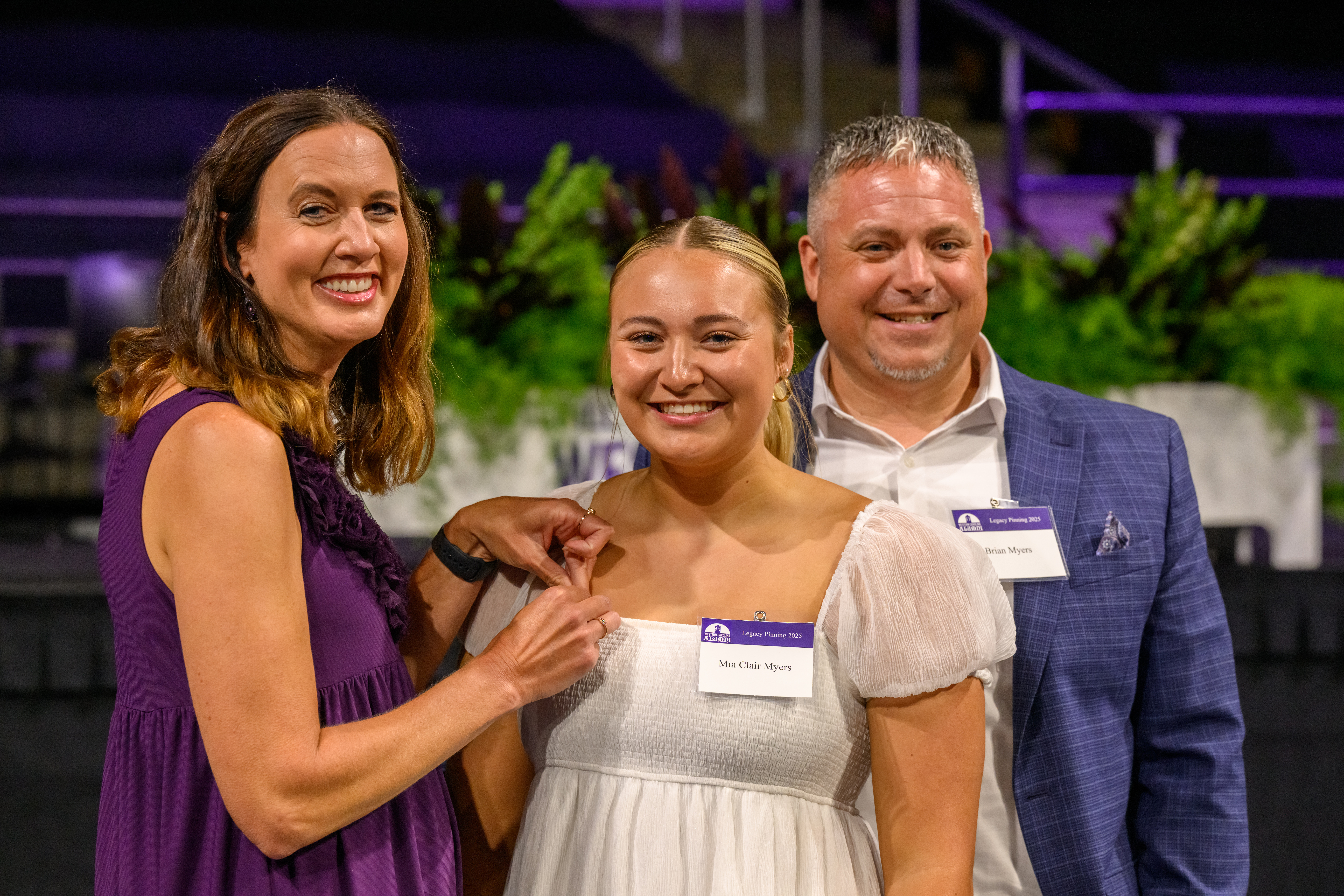 Keynote speakers Kelly Myers (left) and Brian Myers (right) pin daughter Mia Clair Myers at Ģ������Ƶ’s Legacy Pinning ceremony.