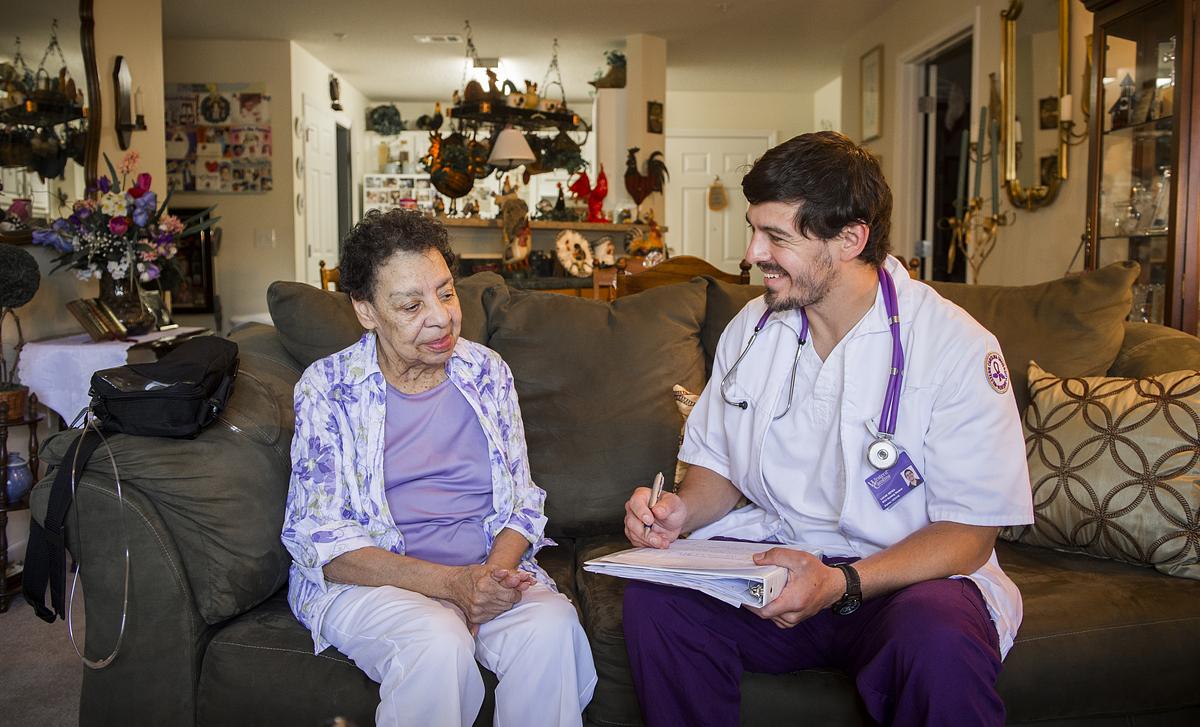 Nursing student assisting patient