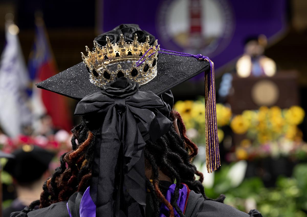 graduating student with a cap and crown on top