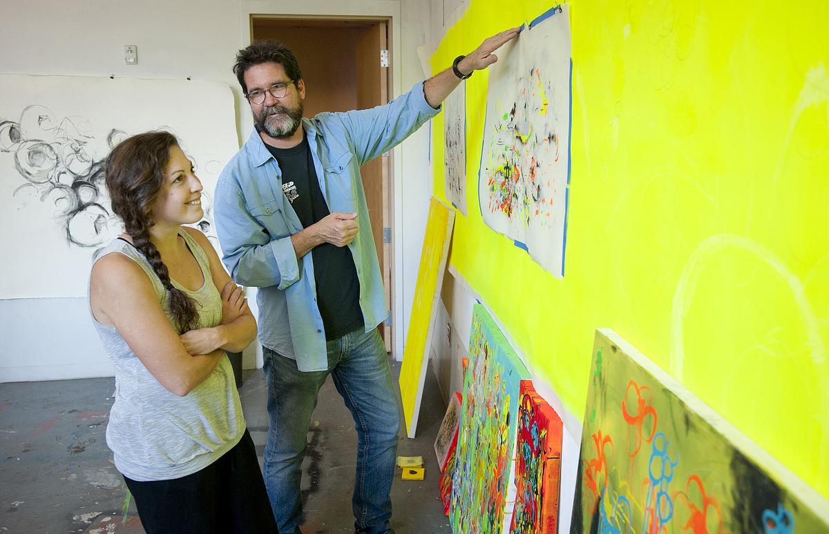 M.F.A. Teacher teaching a student.