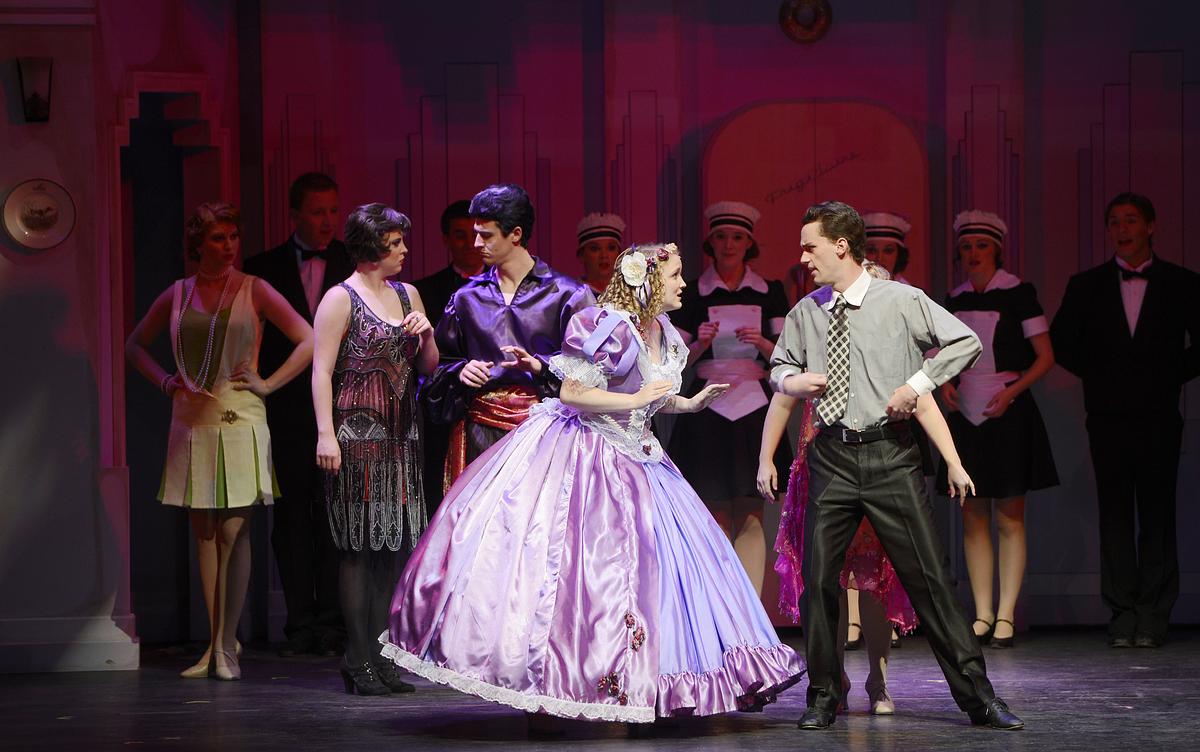 Students acting in a live performance on stage