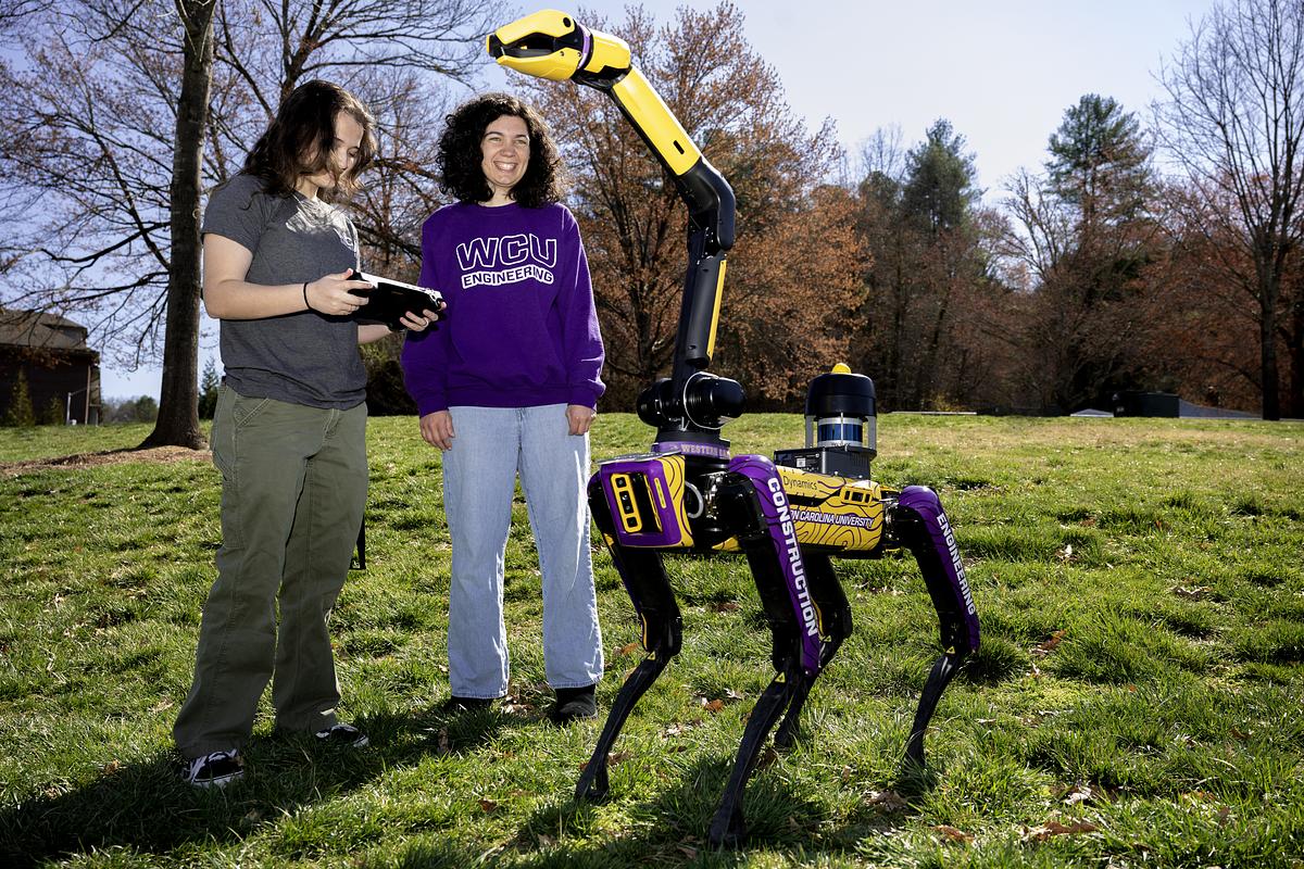WCU Engineering students work with a robot