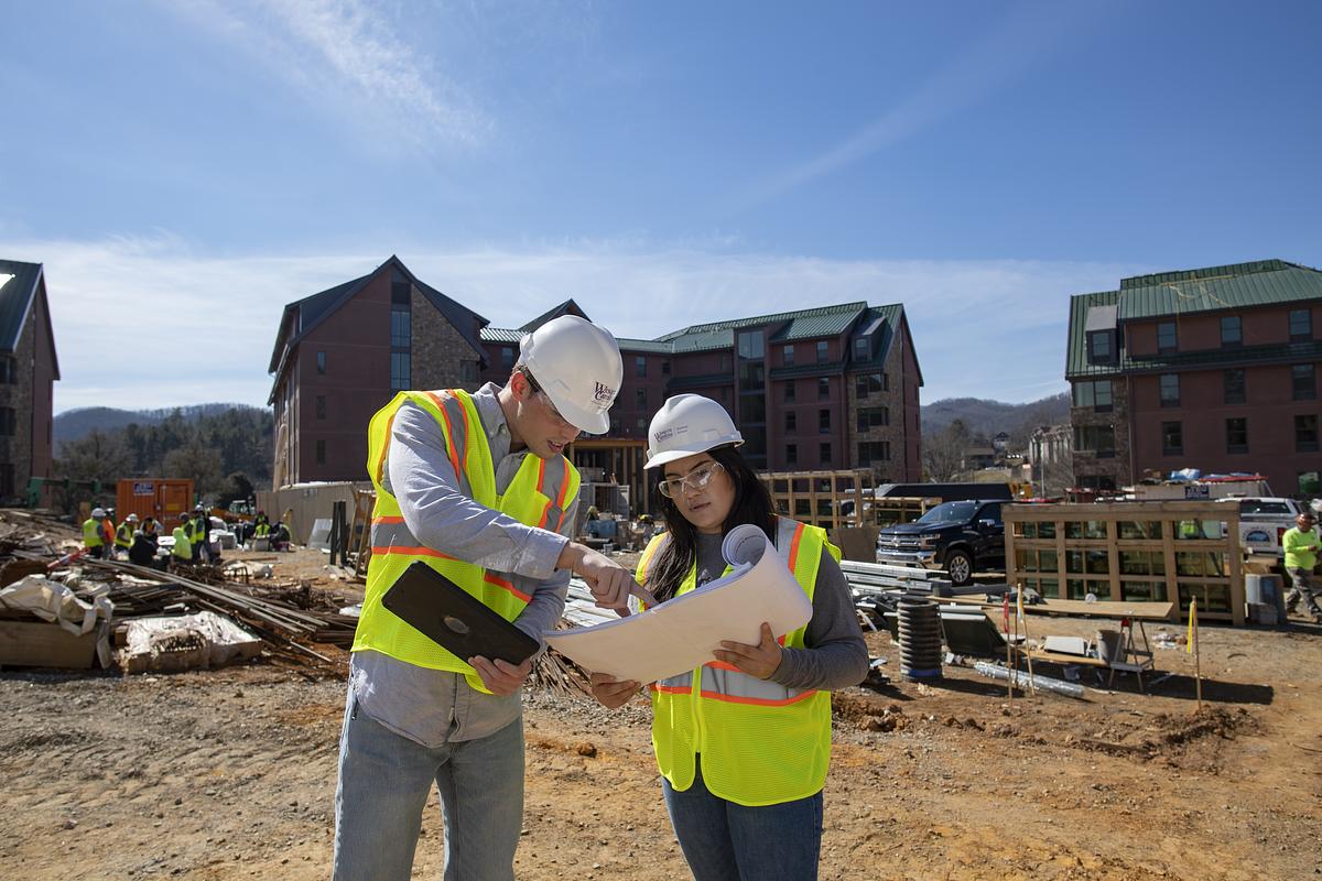 Students review construction plans