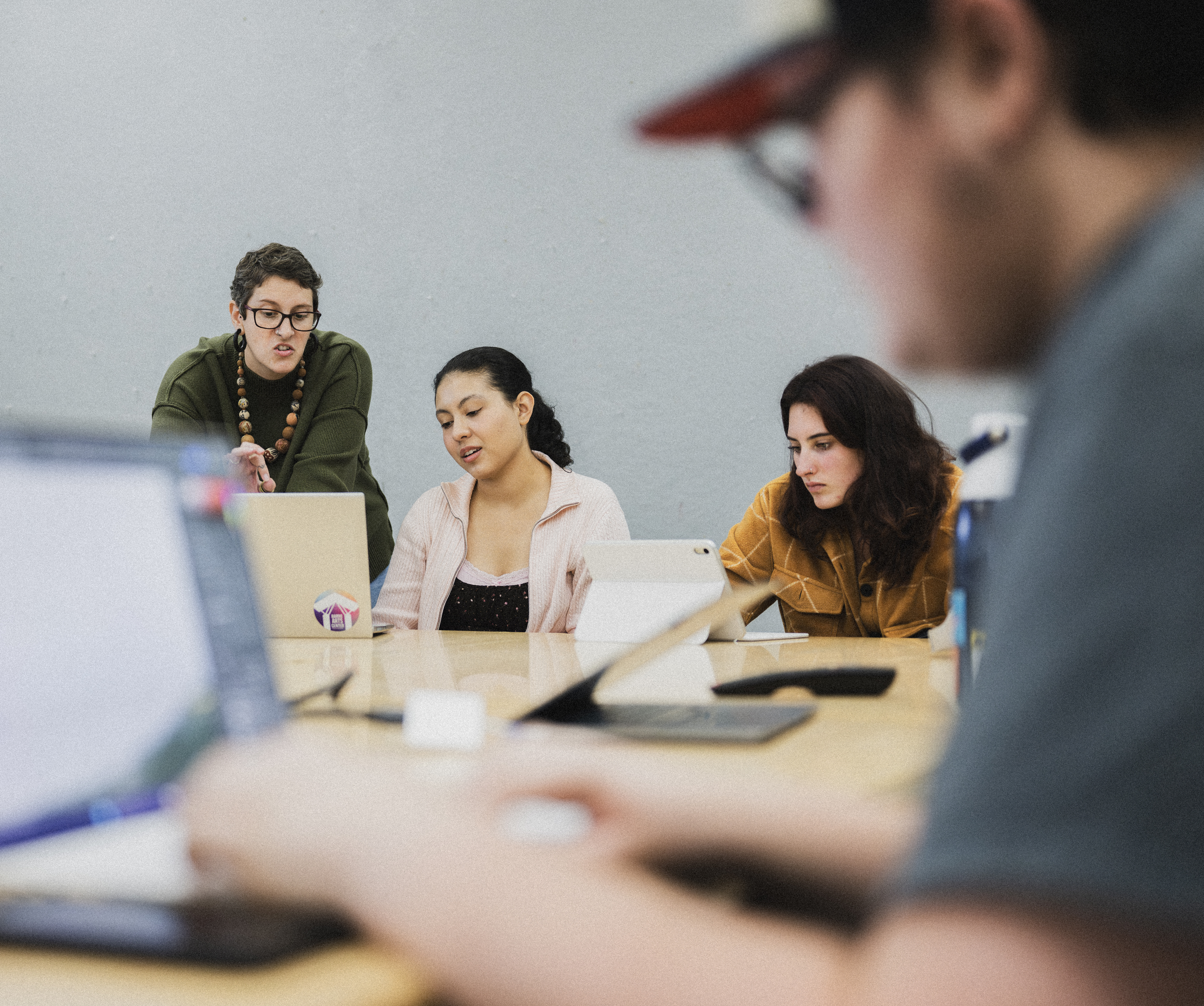 Rebekah Alvani works with students to restore the photos