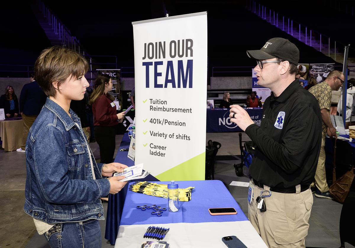 Students cheering in a full stadium at the WCU football homecoming game