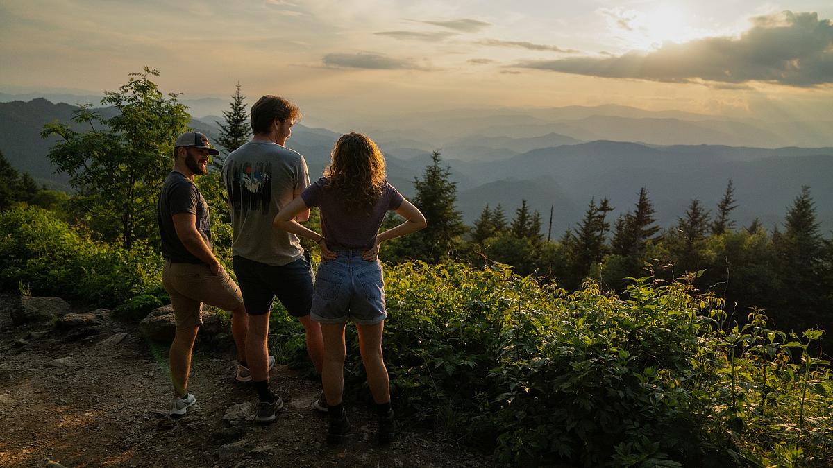 Students on a hike at an overlook of the blue ridge mountains