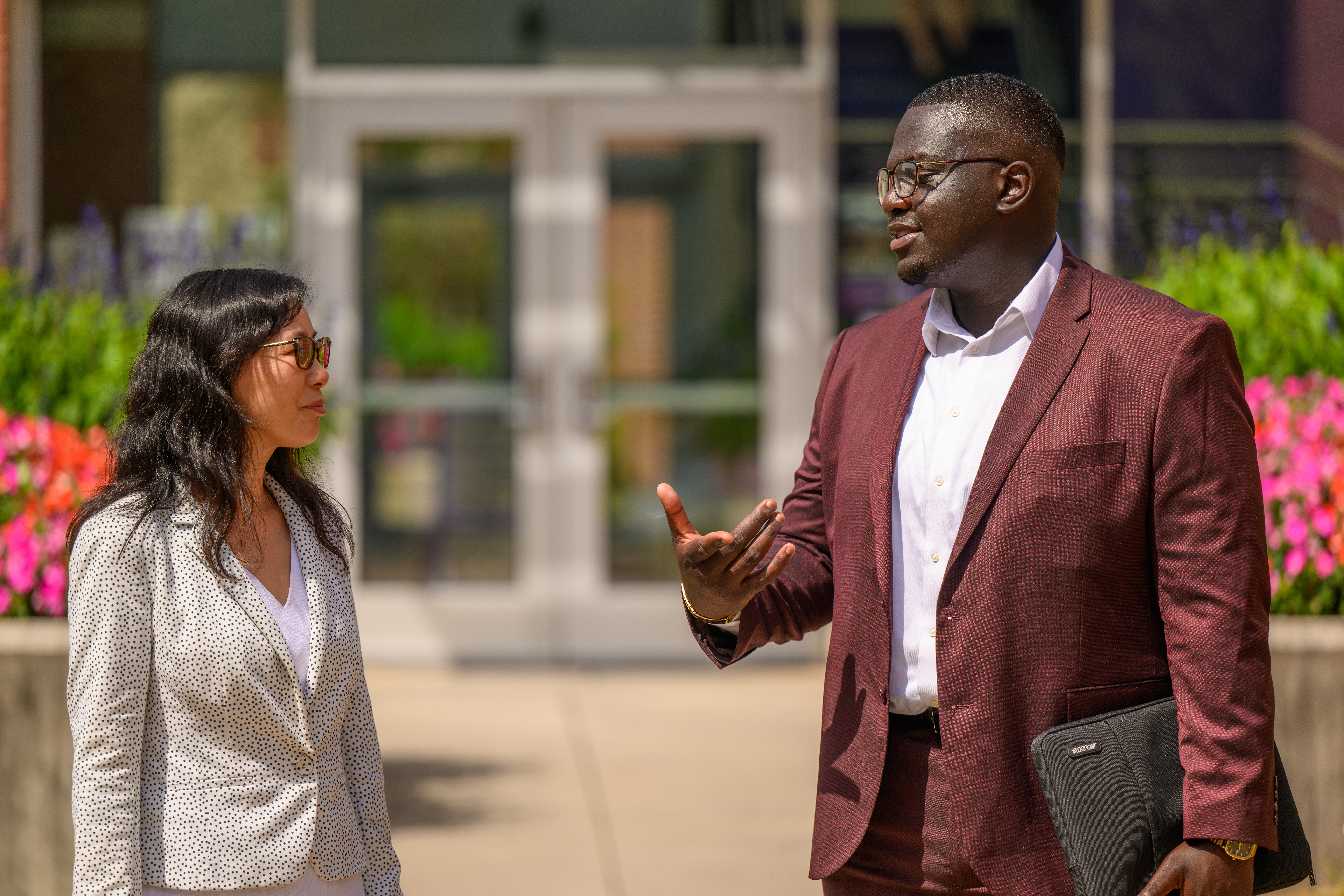 Student talking with a professor