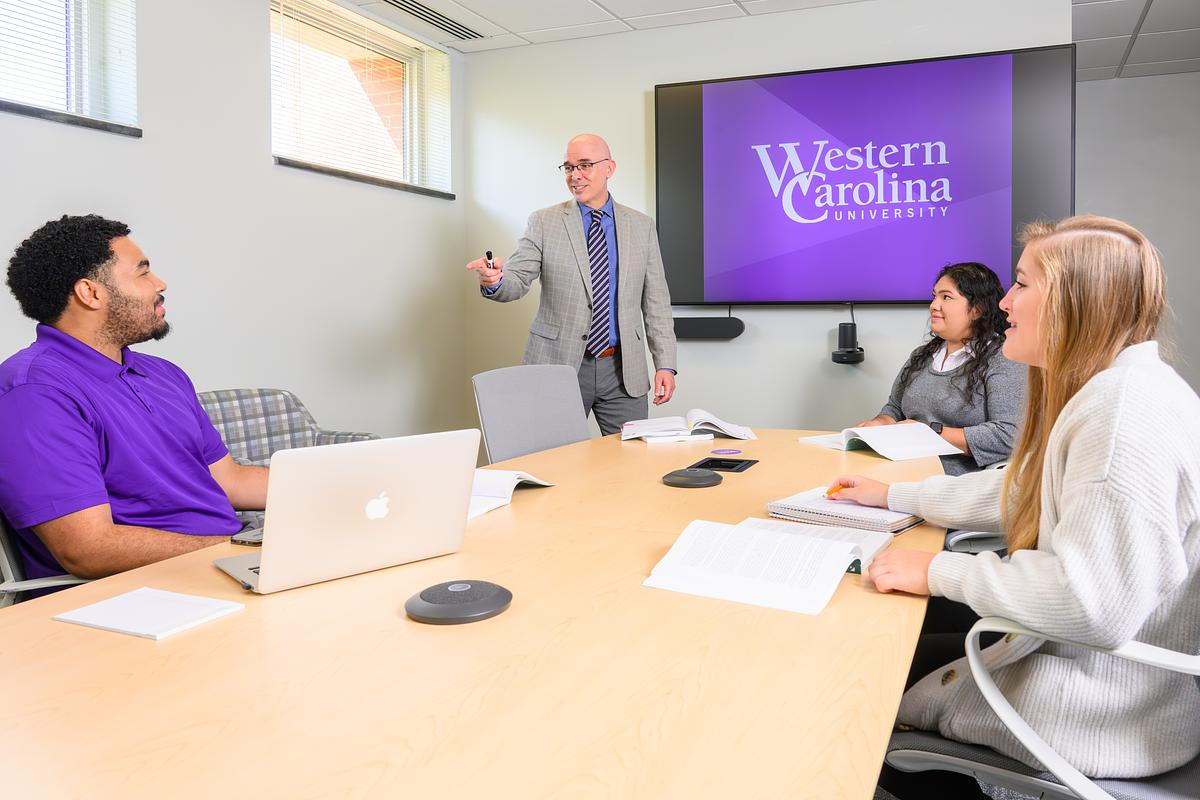 Students talking to professor