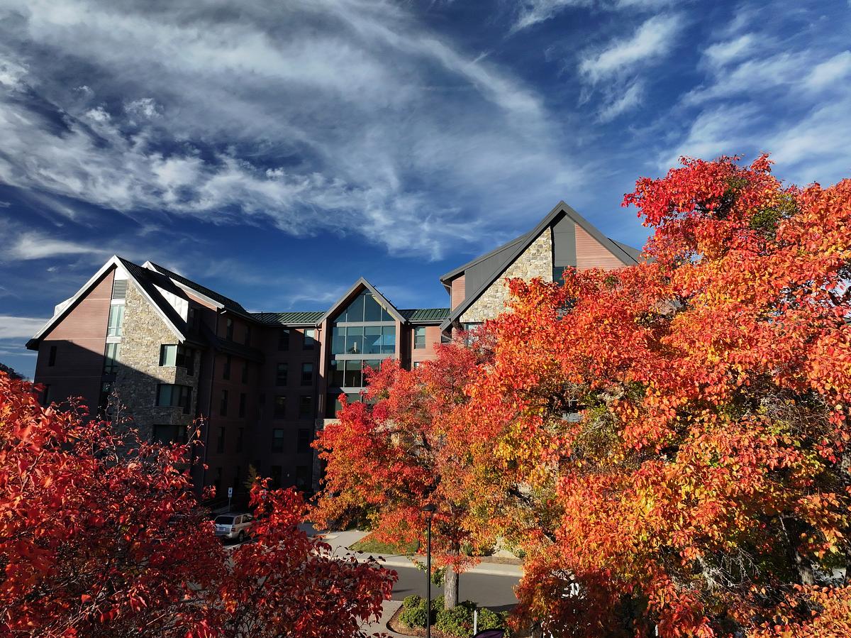 The Rocks dormitory on a clear day in the fall