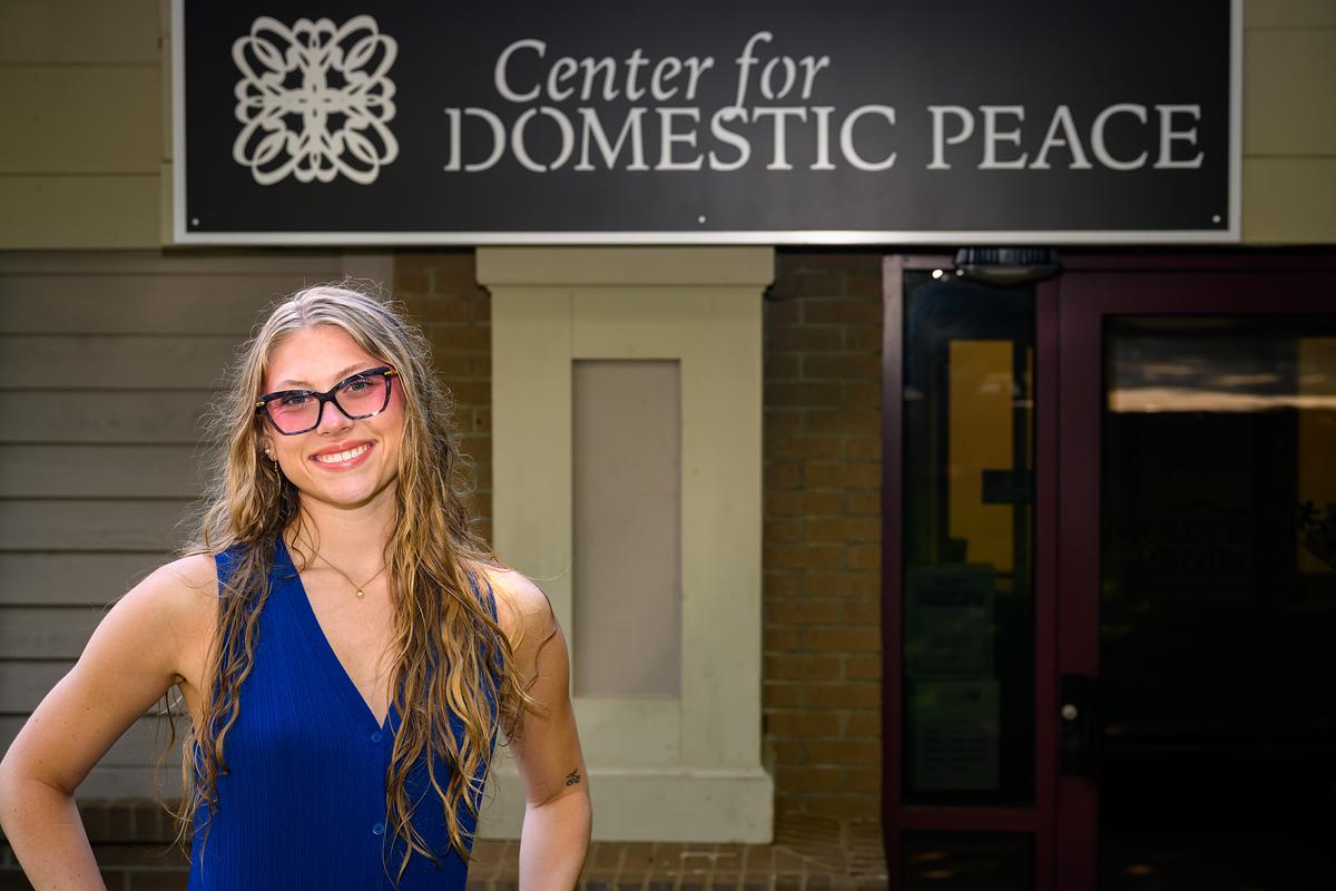 Young woman standing outside of the Center for Domestic Peace
