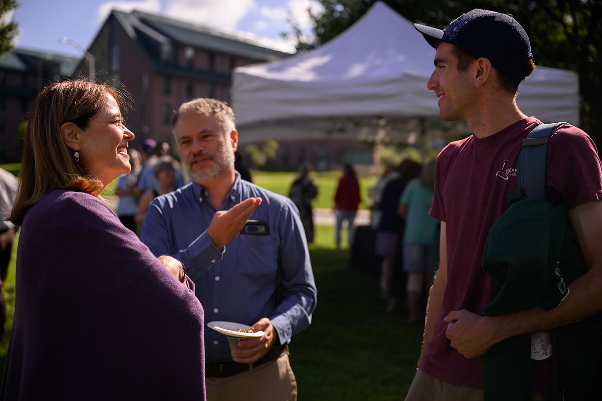 Chancellor Brown talking with people on campus for an event
