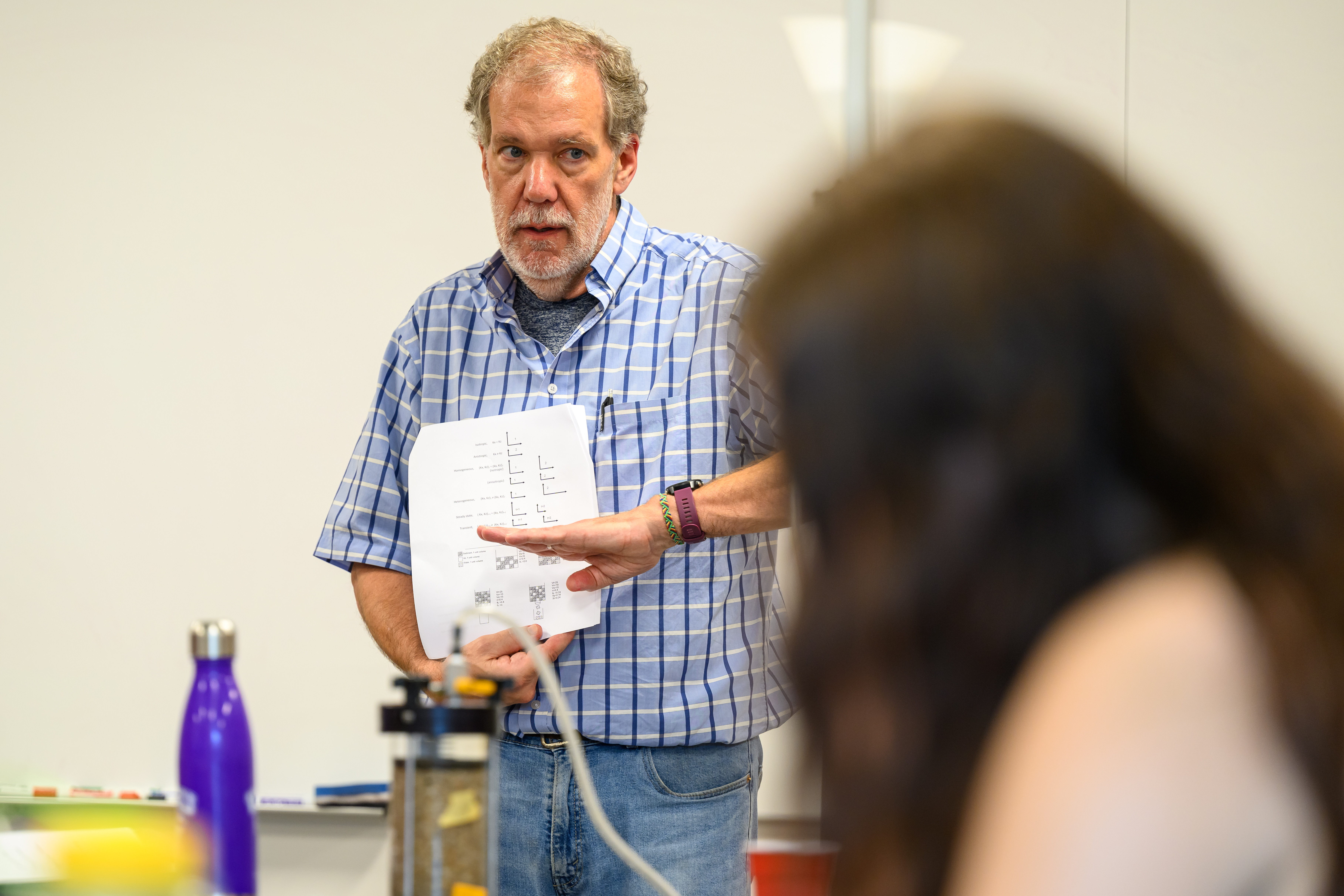 Mark Lord works with students