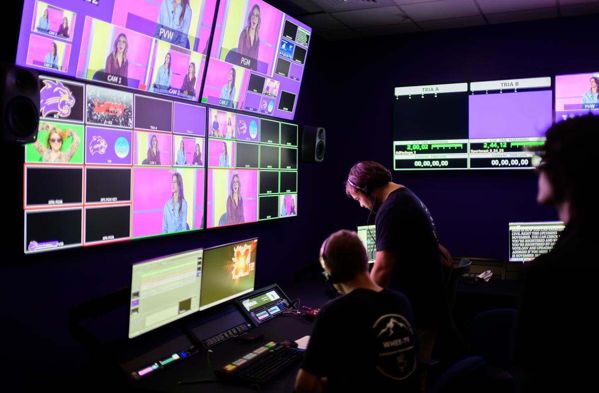 Students look at multiple screens in the newly renovated WHEE-TV studio
