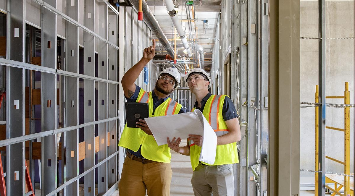 Students work at a construction site