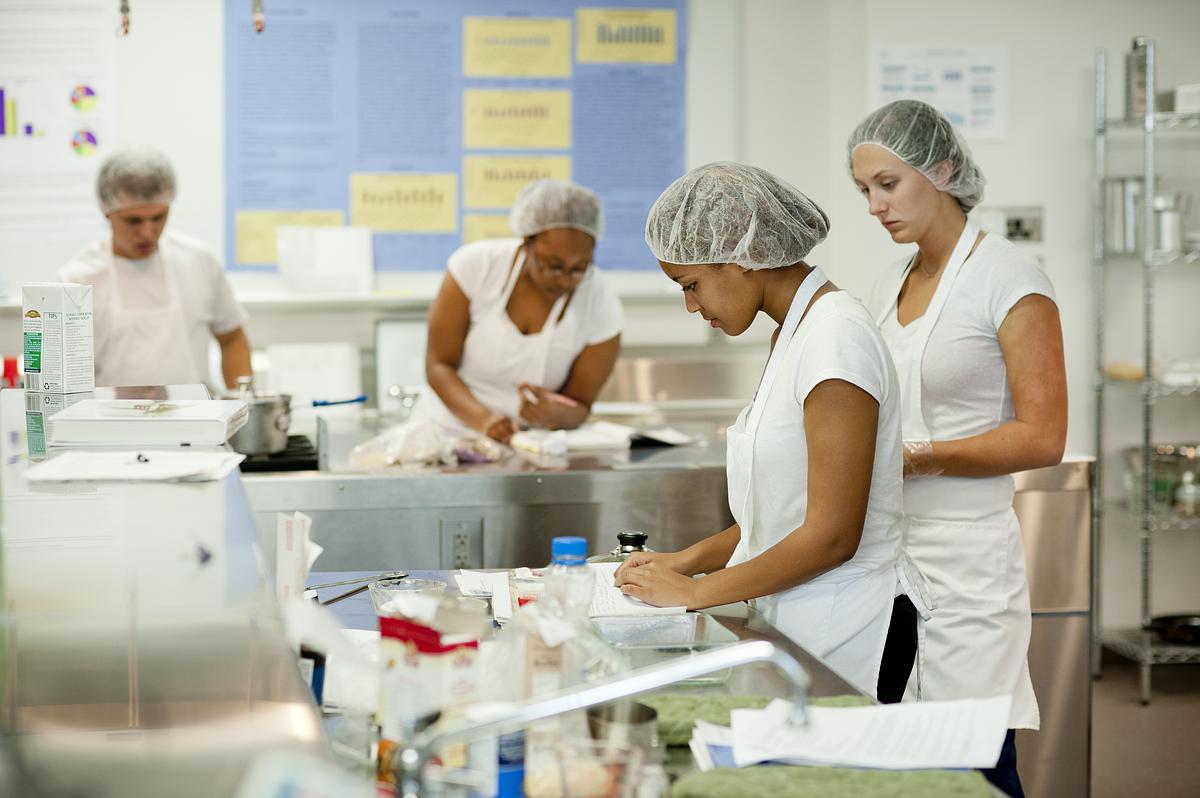 Nutrition and Dietetics students working together in a kitchen