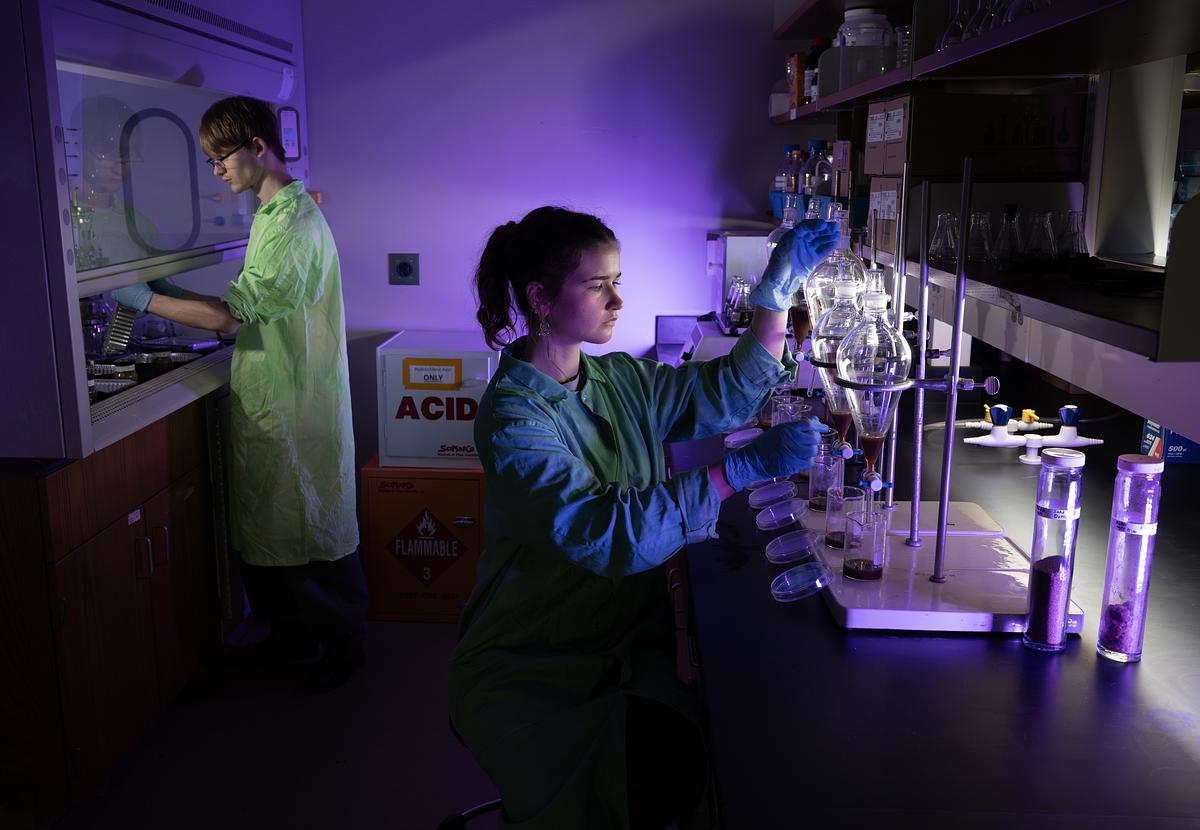 Undergraduate students conducting research in a lab