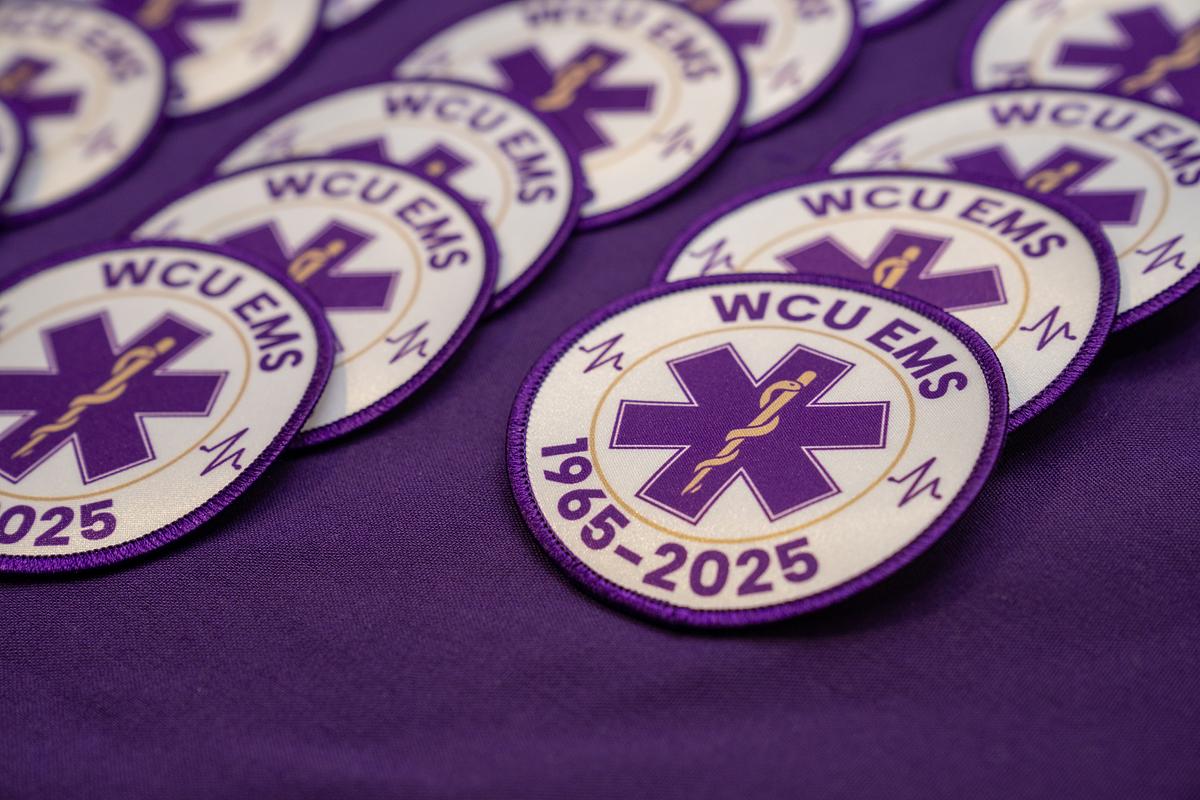 Picture of multiple WCU EMS Badges on a table