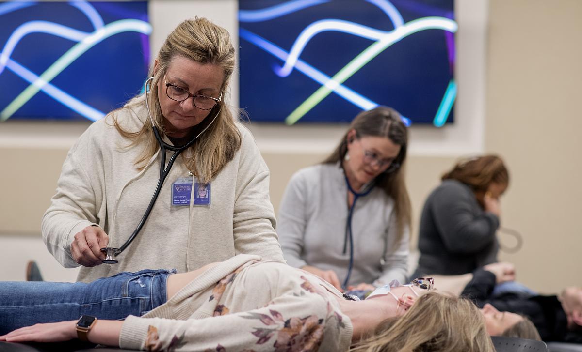 Family nurse practitioners practicing with guidance from the instructors