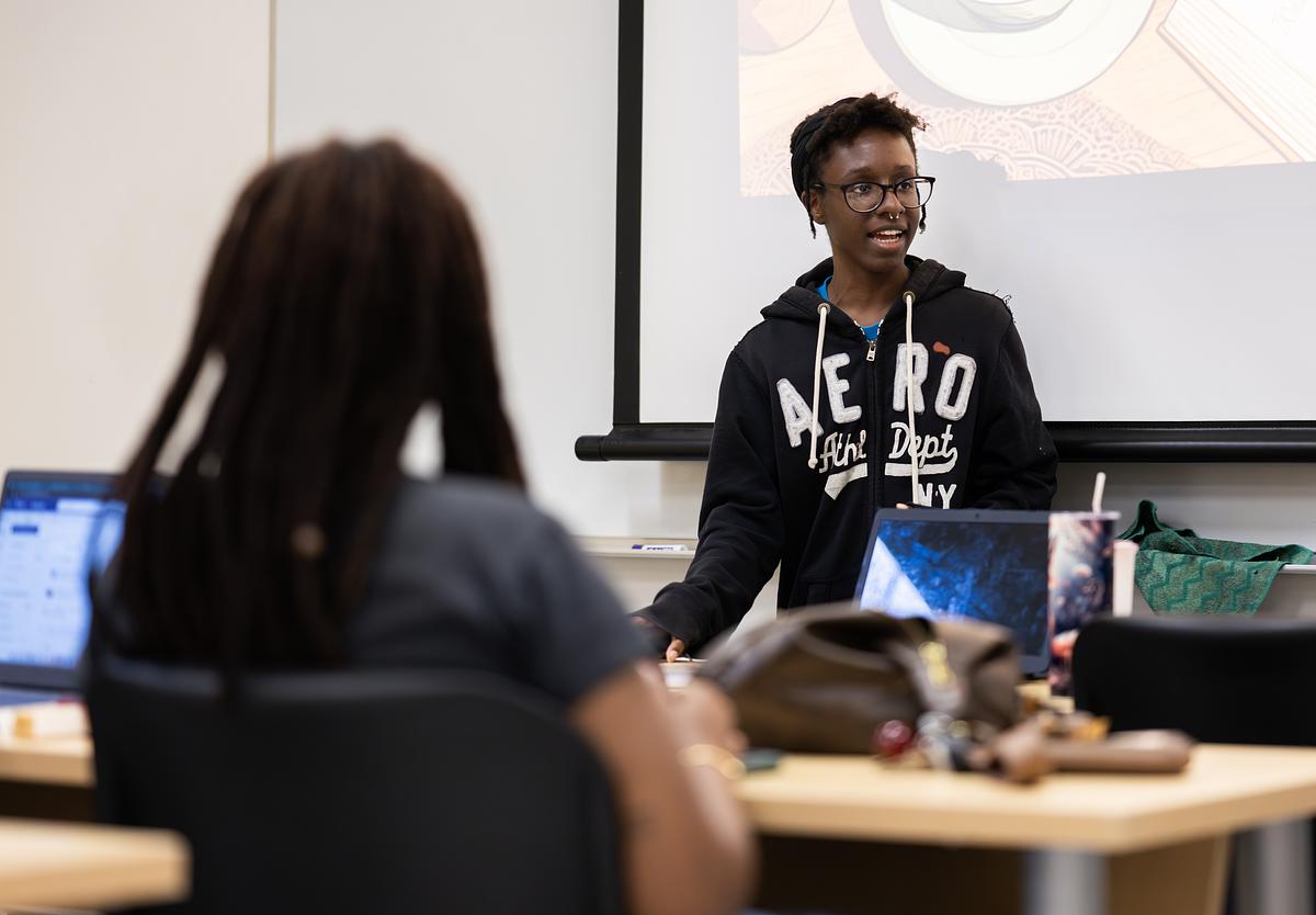 Student giving a presentation in a Global Black Studies class
